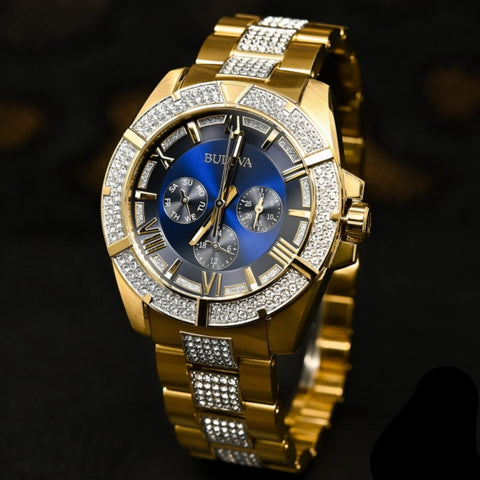 Men's Crystal Watch
From the Crystals Collection
In gold-tone stainless steel. Embellished with 318 Swarovski? Crystals on bezel, blue dial and bracelet, six-hand multi-feature movement, luminous hands and markers, mineral glass, gold-tone stainless bra
