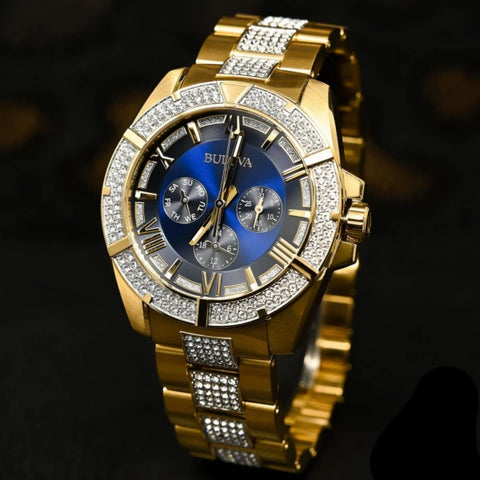 Men's Crystal Watch
From the Crystals Collection
In gold-tone stainless steel. Embellished with 318 Swarovski? Crystals on bezel, blue dial and bracelet, six-hand multi-feature movement, luminous hands and markers, mineral glass, gold-tone stainless bra